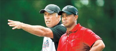 Tiger&nbsp;Woods&nbsp;listens&nbsp;to&nbsp;his&nbsp;caddie&nbsp;Steve&nbsp;Williams&nbsp;during&nbsp;the&nbsp;final&nbsp;round&nbsp;of&nbsp;The&nbsp;Tour&nbsp;Championship&nbsp;in&nbsp;Atlanta&nbsp;in&nbsp;this&nbsp;September&nbsp;27,&nbsp;2009,&nbsp;photo.&nbsp;Jack&nbsp;Nicklaus&nbsp;thinks&nbsp;Woods&nbsp;would&nbsp;return&nbsp;at&nbsp;the&nbsp;US&nbsp;Masters.