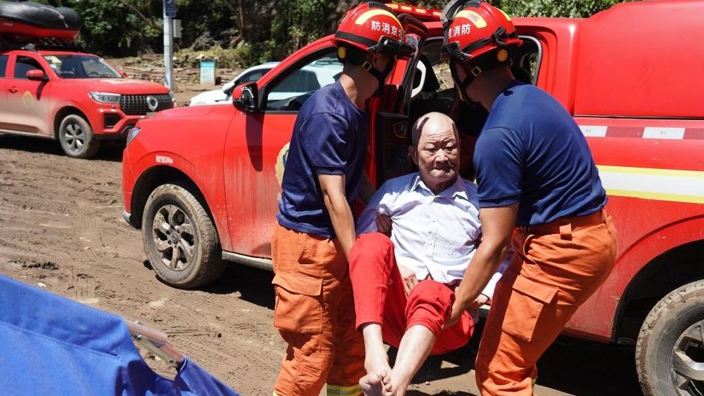 Rescue teams evacuate stranded residents, clear damaged sites in flood-affected areas in Beijing