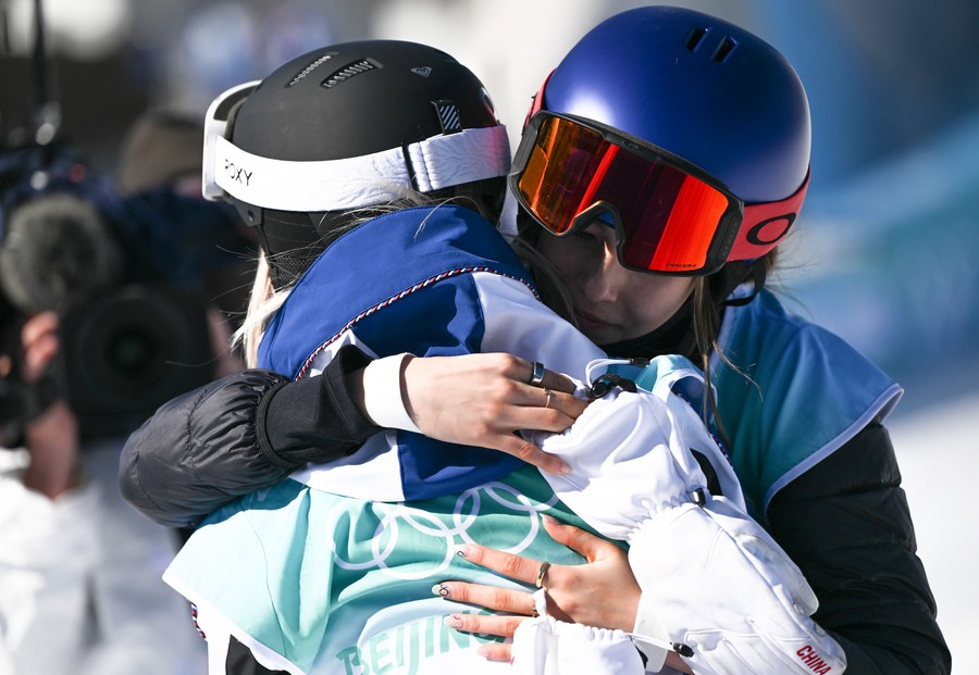 Gu Ailing of China (R) and Tess Ledeux of France hug each other during the women’s freeski big air final at Big Air Shougang in Beijing, Feb. 8, 2022. (Xinhua/Xue Yuge)